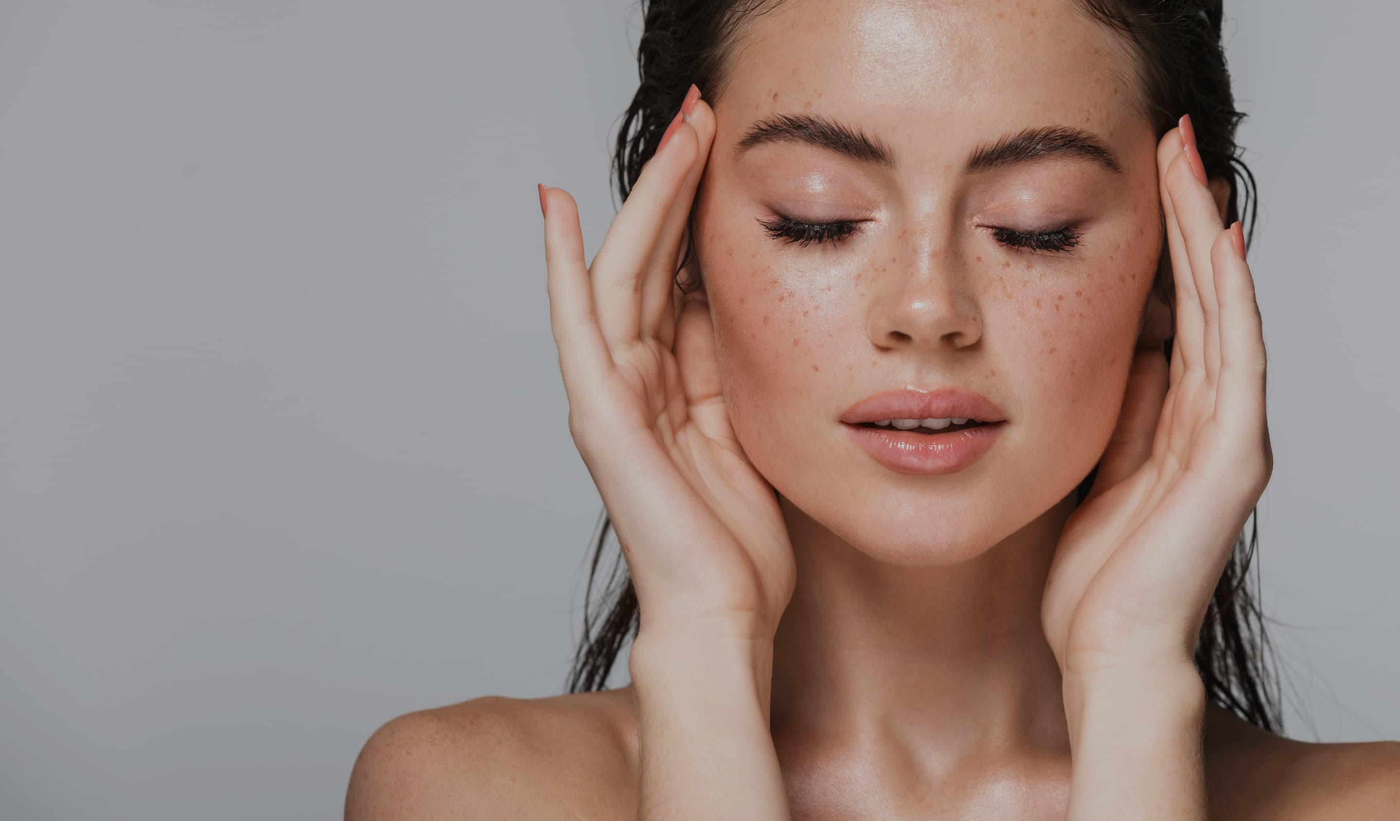 Woman with hands on her face